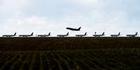 A Southwest Airlines flight takes off as United Airlines planes sit parked on a runway at Denver International Airport as the coronavirus pandemic slows air travel on April 22, 2020 in Denver, Colorado. Compared to the same time last year, Denver International Airport is operating 1,000 fewer flights daily. (Photo by Michael Ciaglo/Getty Images)