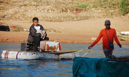 Cut off from the world by KZN floods, these residents are forced to use rickety homemade ferries to get to work, school and hospital
