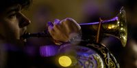 Penitents play the trumpet in the Santo Entierro Procession during Holy Week on March 29, 2024 in Albacete, Spain. (Photo: Juan Naharro Gimenez/Getty Images)