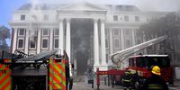 Firefighters at Parliament in Cape Town on 3 January 2022. (Photo: GCIS)