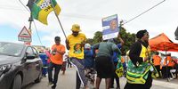 Members of political parties, the ANC, EFF, DA and Good dance and sing outside a voting station in Nyanga where a by-election for Ward 38 took place on Wednesday, 23 November. Candidates for the ward were Masiza Yengwa, an independent, Sakhele Fezekile Kula of the Africa Restoration Alliance (ARA), Suzanne Zumana of the ANC, Siyamthemba Sydney Ndlezana of the DA, Tshepo Phillip Motlhabane of the EFF, Lulama Benge of Good, Vuyani Nelson Skolpati of the Pan Africanist Congress of Azania (PAC) and Nceba Godfrey Tyobeka of the United Democratic Movement (UDM). (Photo: Xabiso Mkhabela)