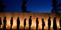 Visitors gather to pay respects during the Flight 93 National MemorialÕs annual Luminaria on the eve of 16th Anniversary ceremony of the September 11th terrorist attacks, September 10, 2017 in Shanksville, PA. United Airlines Flight 93 crashed into a field outside Shanksville, PA with 40 passengers and 4 hijackers aboard on September 11, 2001. (Photo by Jeff Swensen/Getty Images)