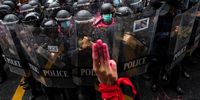 BANGKOK, THAILAND - AUGUST 17: A protester is seen giving a three-fingers salute during the gathering at the Royal Thai Police Headquarter in downtown to protest against violence from law enforcement toward anti-government protesters on August 17, 2021 in Bangkok, Thailand. Increasingly violent protests have continued in Thailand as frustration builds over a slow vaccine rollout and record-high Covid-19 infection numbers. (Photo by Sirachai Arunrugstichai/Getty Images)