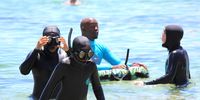 The young participants in I Am Water's Ocean Guardians workshop are accompanied by coaches trained in water safety while they snorkel off Windmill Beach in Simon's Town. (Photo: Tamsin Metelerkamp)