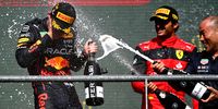 SPA, BELGIUM - AUGUST 28: Race winner Max Verstappen of the Netherlands and Oracle Red Bull Racing and Third placed Carlos Sainz of Spain and Ferrari celebrate on the podium during the F1 Grand Prix of Belgium at Circuit de Spa-Francorchamps on August 28, 2022 in Spa, Belgium. (Photo by Dan Mullan/Getty Images)