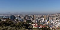 The port area stands beyond commercial high-rise properties in Cape Town. (Photo: Dwayne Senior / Bloomberg via Getty Images)