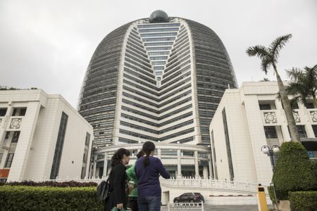 China Firms Cashing Out of Overseas Bets at Near-Record Pace