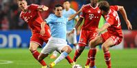 Manchester City’s Jesus Navas (second left) in action against Bayern Munich players (from left) Bastian Schweinsteiger, David Alaba and Thomas Mueller during the UEFA Champions League group D soccer match in Manchester on 2 October 2013. (Photo: EPA / Peter Powell)