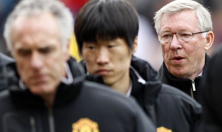 Manchester Utd earnings hit by poor cup runs