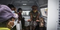 Three women sat in police van after being caught illegally entering into South Africa. Upon questioning by an immigration official 2 admitted to crossing over the Limpopo River while the third (R) who passed through all the processes at the porter of entry could not explain why her passport was not stamped.<br>Photo / Shiraaz Mohamed.