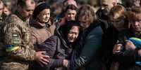 The mother of Oleh Yaschyshyn (center) cries during the funeral service for Oleh Yaschyshyn, Sergiy Melnyk, Rostyslav Romanchuk and Kyrylo Vyshyvany in the Lychakivske cemetery on March 15 in Lviv. The men died in an airstrike on the nearby International Center for Peacekeeping and Security at the Yavoriv military complex. (Photo by Alexey Furman/Getty Images)