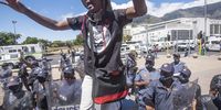 Various groups and organisations protest on February 24, 2021 in Cape Town, South Africa. It is reported that the protesters wanted to picket and protest outside parliament during the budget speech but they were moved by the police to the Grand Parade. (Photo by Gallo Images/Brenton Geach)