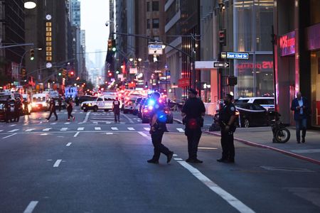 Gunman kills at least 4 people, including officer, in mid-Manhattan skyscraper