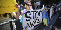 Protesters hold placards in support of Ukraine outside Parliament in Cape Town, South Africa, 1 March 2022. (Photo: EPA-EFE / NIC BOTHMA)