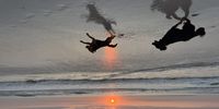 Sundowners in the surf (Guinness and Sadie at Blaauwberg). Photographer: Donald Clark