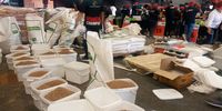 Soya mince is put into buckets to create a production line for volunteers from some of the biggest corporations to pack into smaller bags and boxes for Mandela Day in Durban. (Photo: Naledi Sikhakhane)