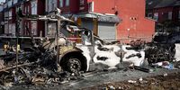  Police tape cordons off the remains of a burnt out bus after civil disturbance last night on July 19, 2024 in Leeds, England. Riots took hold in the Harehills area of Leeds last night, reportedly after children were forcibly removed from their family and taken into care. (Photo by Christopher Furlong/Getty Images)