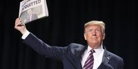 U.S. President Donald Trump holds up a copy of USA Today newspaper with a banner headline that reads "Acquitted" as he arrives to annual National Prayer Breakfast at the Washington Hilton in Washington, D.C., U.S., on Thursday, Feb. 6, 2020. Trump used the annual National Prayer Breakfast Thursday to attack his political enemies after his partisan acquittal of impeachment charges. Photographer: Oliver Contreras/Sipa/Bloomberg via Getty Images