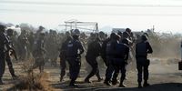 Police open fire on mine workers after a gathering outside Nkaneng informal settlement near the Lonmin mine in Rustenburg, North West. (Photo: Felix Dlangamandla)