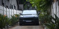 A Porsche Cayenne belonging to Edwin Sodi and his company Blackhead Consulting is seen leaving the Blackhead Consulting offices after it was attached by the Asset Forfeiture Unit 6 October 2020, Bryanston. <br>Photo / Shiraaz Mohamed