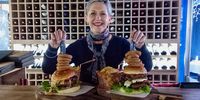 Margriet Wilkens with Joop’s towering new beef and chicken burgers. (Photo: Wanda Hennig)
