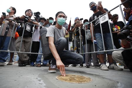 Thai police seize plaque targeting monarchy, weigh charges