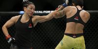 Carla Esparza punches Virna Jandiroba of Brazil during their women's strawweight bout at UFC Fight Night at BB&amp;T Center on April 27, 2019 in Sunrise, Florida.   Michael Reaves/Getty Images/AFP (Photo by Michael Reaves / GETTY IMAGES NORTH AMERICA / AFP)