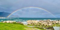 Perfect rainbow with its 7 colours in Camps Bay. 