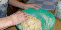 Angelina simply dips into the Molini Rosetti flour packet and mixes it into the potato lightly, by hand. Photo: Margot Patterson