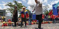 Nicolas Maduro, Venezuela's president, right, dances during a campaign rally in Charallave, Miranda state, Venezuela, on Tuesday, May 15, 2018. Venezuelans head to the polls on May 20, as foreign leaders call for a suspension and the country's main opposition alliance shun the elections. Photographer: Carlos Becerra/Bloomberg via Getty Images