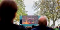 Members of the public watch the big screen during the State Funeral of Queen Elizabeth II on September 19, 2022 in Windsor, England. The committal service at St George's Chapel, Windsor Castle, took place following the state funeral at Westminster Abbey. A private burial in The King George VI Memorial Chapel followed. Queen Elizabeth II died at Balmoral Castle in Scotland on September 8, 2022, and is succeeded by her eldest son, King Charles III. (Photo: Alex Pantling / Getty Images)