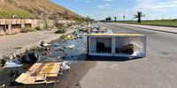 Residents placed an old fridge in the middle of Stanford Road to warn motorists of the deep, water-filled pothole. (Photo: Nkosazana Ngwadla)