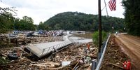 The Rocky Broad River flows into Lake Lure and overflows the town with debris from Chimney Rock, North Carolina after heavy rains from Hurricane Helene on September 28, 2024, in Lake Lure, North Carolina. Approximately six feet of debris piled on the bridge from Lake Lure to Chimney Rock, blocking access. (Photo by Melissa Sue Gerrits/Getty Images)