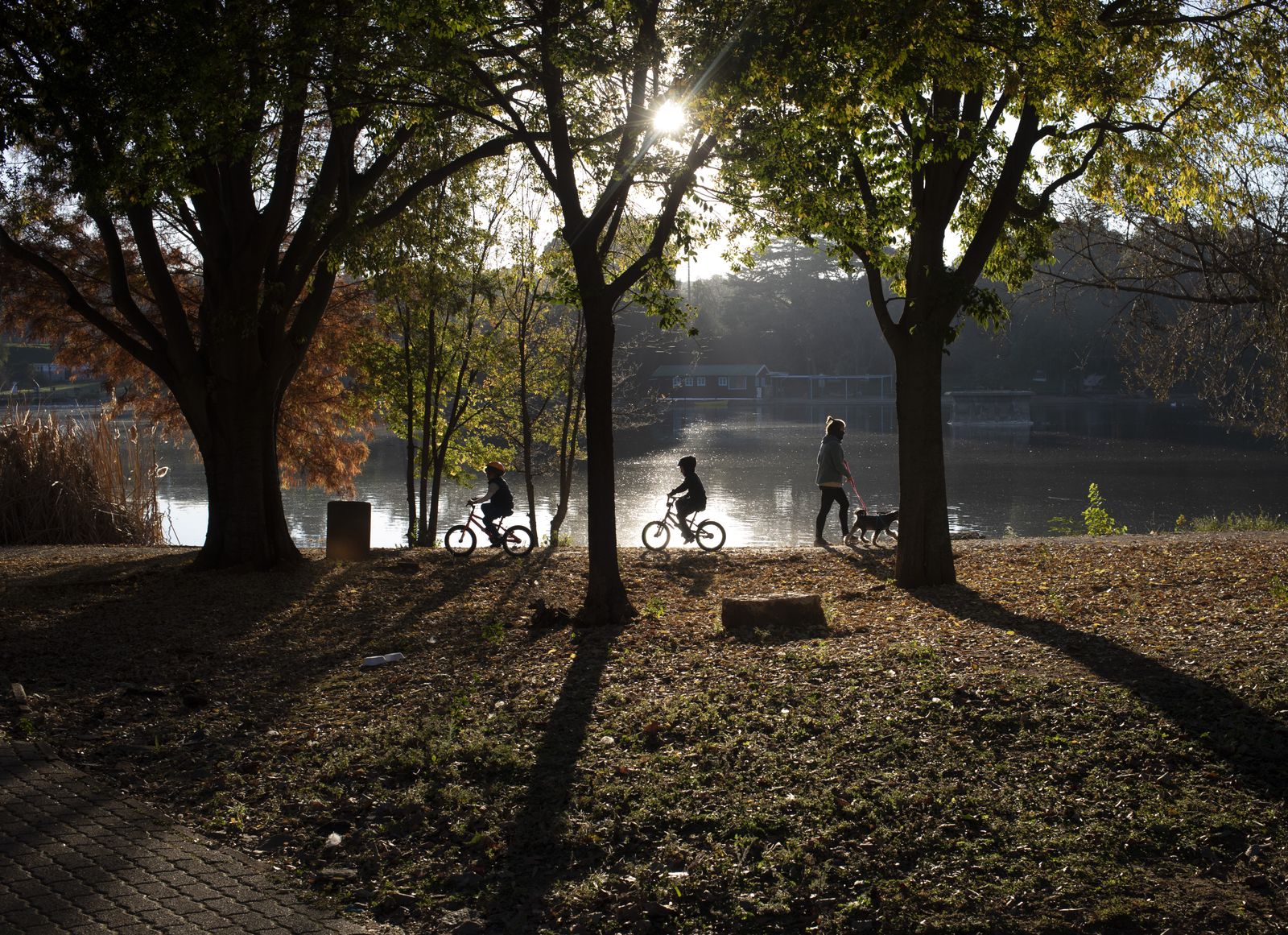 A family walks at Zoo Lake during the national lockdown initiated as a result of the COVID-19 disease and coronavirus pandemic, in Johannesburg, South Africa, 1