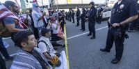 'No Kings' protesters including clergy from Clergy Laity United for Economic Justice rally outside the Metropolitan Detention Center in Los Angeles, California. (Photo: Jill Connelly / EPA)