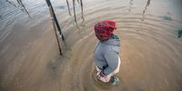 People fetch their belongings from their flooded  homes at a informal settlement in Bloekombos, Kraaifontein in Cape Town on 1 July 2021. (Photo: Gallo Images / Brenton Geach)