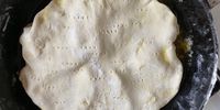 The pastry needs to be tucked under all round the edges before the tarte tatin goes in the oven. (Photo: Tony Jackman)