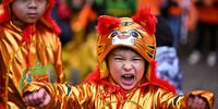 EDINBURGH, SCOTLAND - JANUARY 30: Members of the Scottish Chinese community take part in Edinburgh Chinese New Year Festival on January 30, 2022 in Edinburgh, Scotland. 2022 marks the Chinese Year of the Tiger, Chinese New Year in Edinburgh has become one of the largest celebrations of its kind in Scotland. (Photo by Jeff J Mitchell/Getty Images)