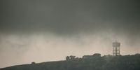 Northcliff Hill looks greyscale in the rain. Photographer: Graeme Adamson