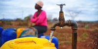 Waiting for a tap to fill a bucket to fill with water
