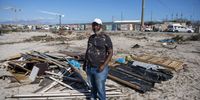 Selby Kolossa stands in front of the pile of wood and metal that was his home. City of Cape Town law enforcement evicted several hundred people from open ground they had occupied over the easter weekend. Khayelitsha Cape Town COVID-19 lockdown, 14 April 2020. (Photo: David Harrison)