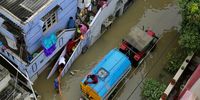 epa09957643 A general view showing the water flooded streets in Hormavu area following heavy rainfall in Bangalore, India, 19 May 2022. Over 40 locations which are administered by the Bruhat Bengaluru Mahanagara Palike (BBMP) recorded more than 100 mm of rainfall which resulted in water inside the houses, cars and bikes submerged and lakes overflowing in the city. The India Meteorological Department has issued a red alert (extremely heavy rainfall) for next two days in the coastal districts.  EPA-EFE/JAGADEESH NV