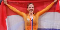 IZU, JAPAN - AUGUST 05: Shanne Braspennincx of Team Netherlands celebrates winning a gold medal while holding the flag of her country during the Women's Keirin final, 1/6th place of the track cycling on day thirteen of the Tokyo 2020 Olympic Games at Izu Velodrome on August 05, 2021 in Izu, Japan. (Photo by Tim de Waele/Getty Images)