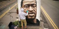 MANCHESTER, UNITED KINGDOM - JUNE 03: Graffiti artist Akse spray paints a mural of George Floyd in Manchester's northern quarter on June 03, 2020 in Manchester, United Kingdom. The death of an African-American man, George Floyd, while in the custody of Minneapolis police has sparked protests across the United States, as well as demonstrations of solidarity in many countries around the world. (Photo by Christopher Furlong/Getty Images)