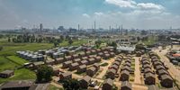 A housing development next to the Sasols petrochemicals plant in Sasolburg. In 2005, the South African governments designated the region as the Vaal Triangle Airshed Priority Area, the first zone in which it would make a concerted effort to lower air pollution. Photographer: Guillem Sartorio/Bloomberg
