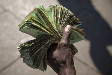 Zimbabweans get new banknotes, but angered by withdrawal limits