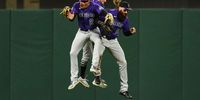SAN FRANCISCO, CALIFORNIA - APRIL 27: Yonathan Daza #2 of the Colorado Rockies, Garrett Hampson #1 and Charlie Blackmon #19 celebrate beating the San Francisco Giants in extra innings at Oracle Park on April 27, 2021 in San Francisco, California. (Photo by Daniel Shirey/Getty Images)