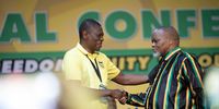 Newly-appointed deputy president Paul Mashatile and chairperson Gwede Mantashe congratulate one another on their appointments at the ANC's 55th national conference in Johannesburg, South Africa on 19 December 2022. (Photo: Leila Dougan)