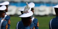 A pigeon stands on cadet's hat during a ceremony to mark the 80th anniversary of Indonesia's Independence Day at the Presidential Palace in Jakarta, Indonesia, 17 August 2025. Indonesia is celebrating the 80th anniversary of its independence from the Netherlands on 17 August 1945.  EPA/ADI WEDA