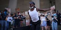 LIVERPOOL, UNITED KINGDOM - JUNE 02: A protester chants to the crowd as people gather for a 'Black Lives Matter' solidarity demonstration outside St George's Hall on June 02, 2020 in Liverpool, United Kingdom. The death of an African-American man, George Floyd, while in the custody of Minneapolis police has sparked protests across the United States, as well as demonstrations of solidarity in many countries around the world. (Photo by Christopher Furlong/Getty Images)